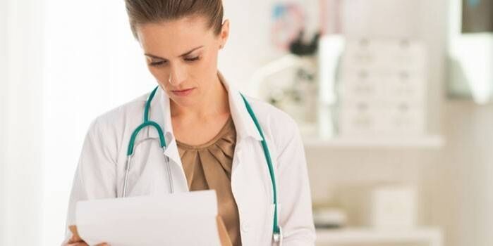 The doctor examines tests to diagnose papillomavirus